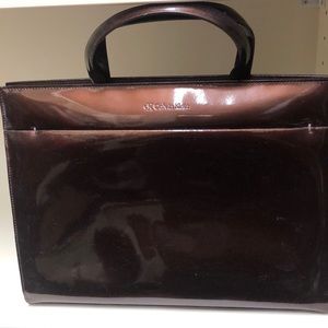 Calvin Klein brown patent leather handbag.